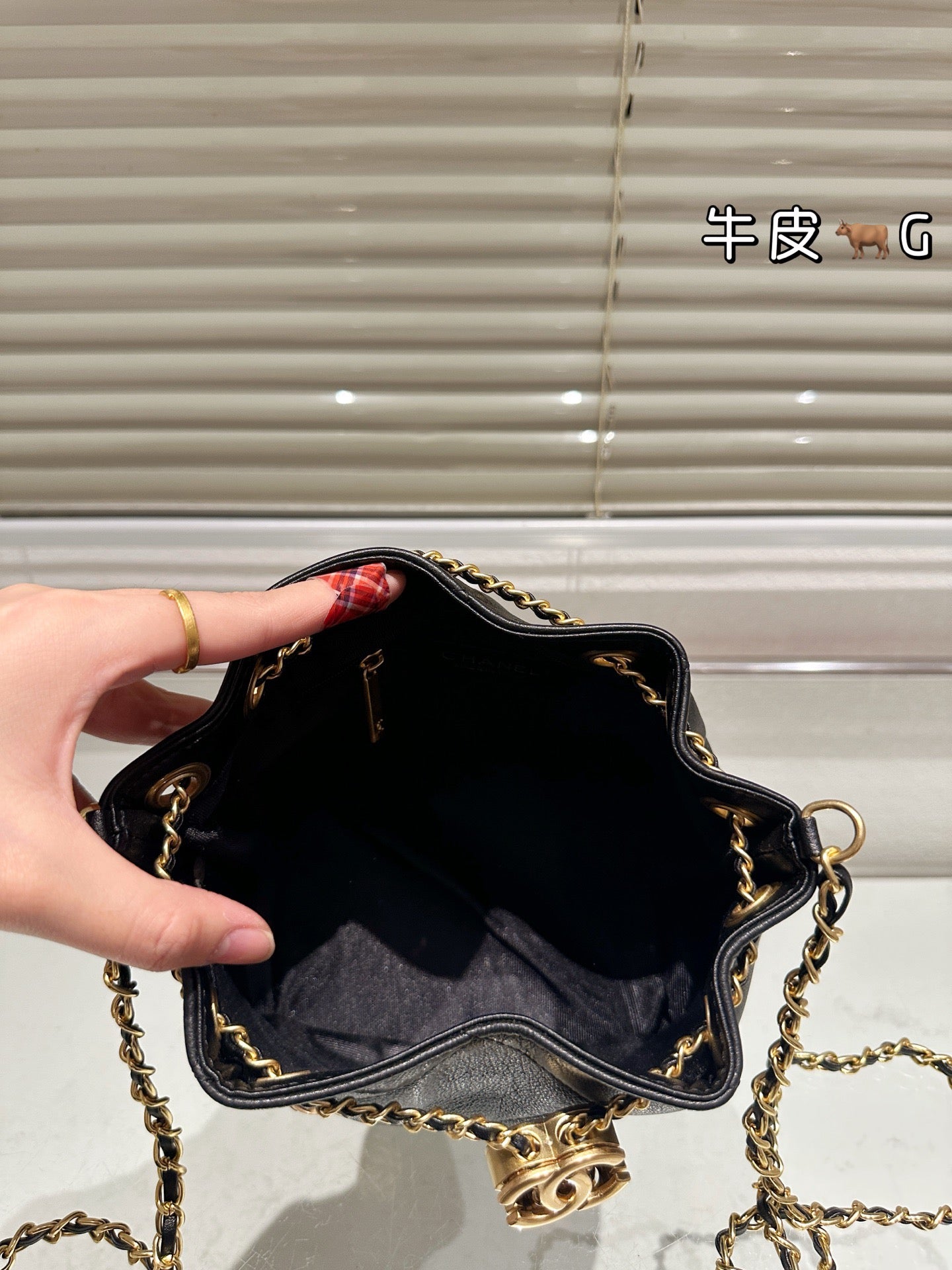 Cc 25K Black and Gold Drawstring Bucket Bag