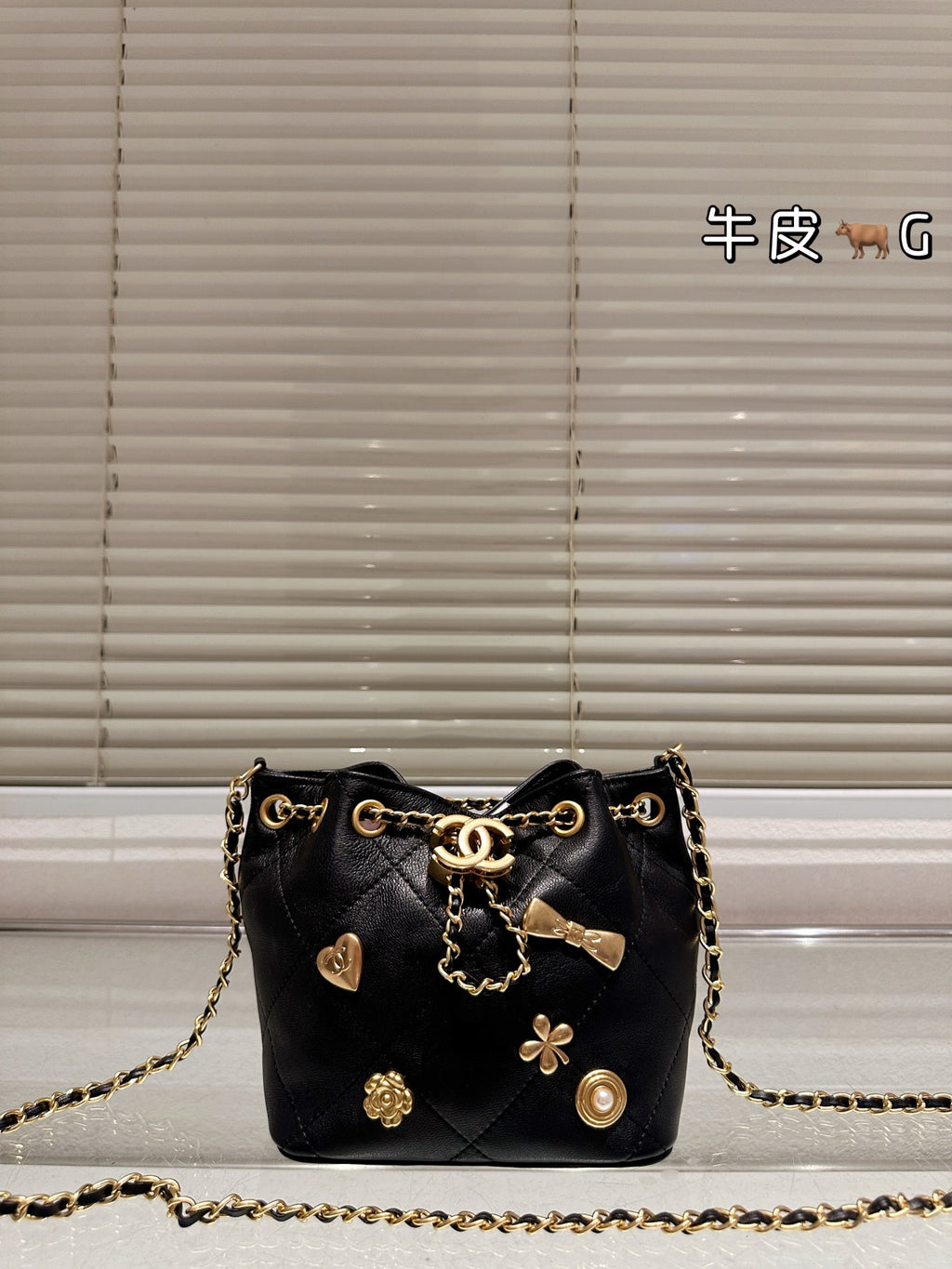 Cc 25K Black and Gold Drawstring Bucket Bag