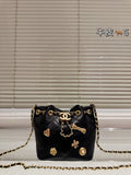 Cc 25K Black and Gold Drawstring Bucket Bag