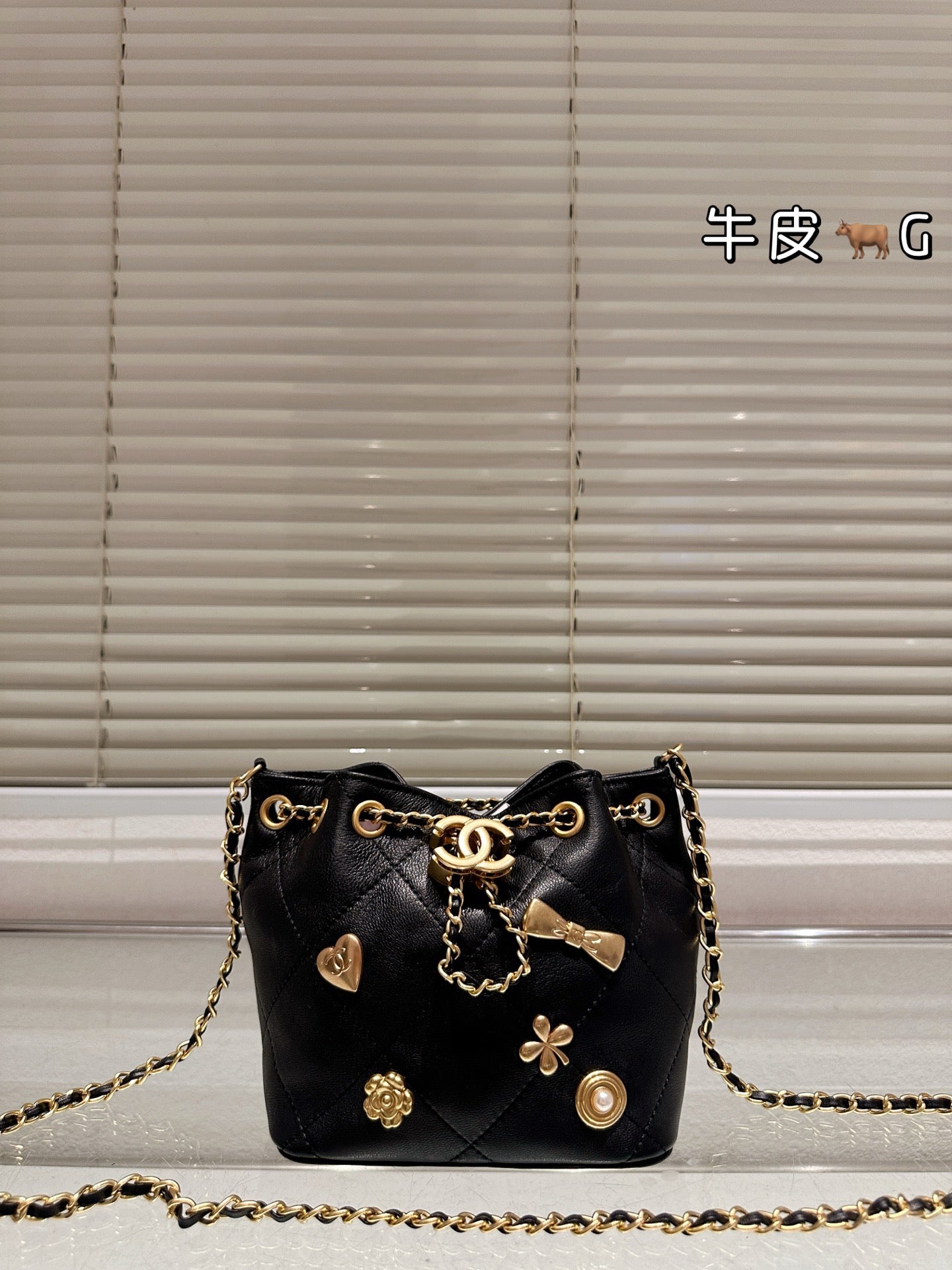 Cc 25K Black and Gold Drawstring Bucket Bag