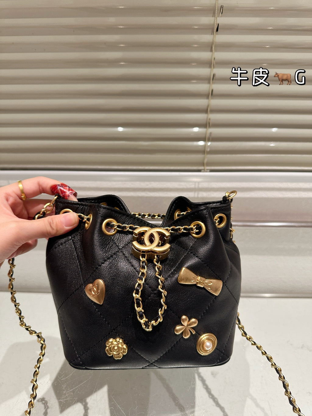 Cc 25K Black and Gold Drawstring Bucket Bag