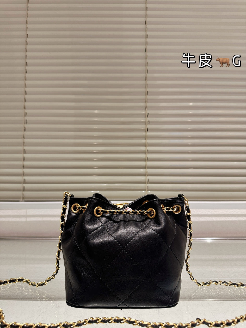Cc 25K Black and Gold Drawstring Bucket Bag