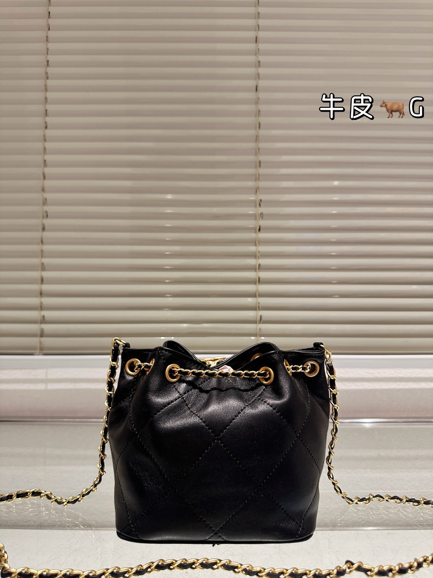 Cc 25K Black and Gold Drawstring Bucket Bag